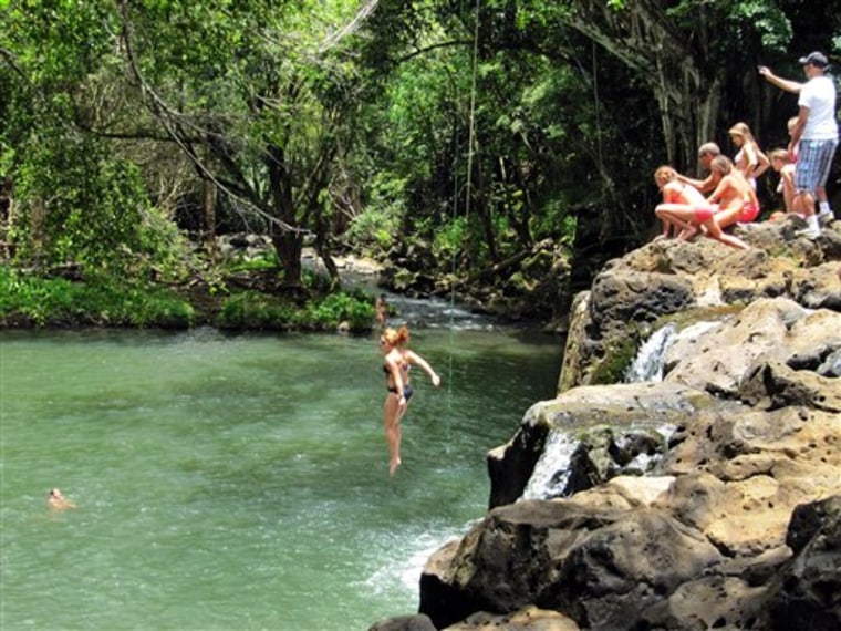 A woman jumps into Kipu Falls in Lihue, Hawaii, on the island of Kauai. But the alluring beauty of the waterfall and natural pool conceals a deadly side. Five visitors to Kauai, all male, have drowned at Kipu Falls in the past five years. 